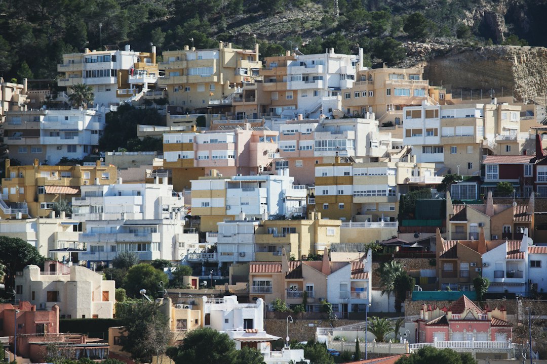 Colourful traditional buildings along a narrow Mediterranean old-town street