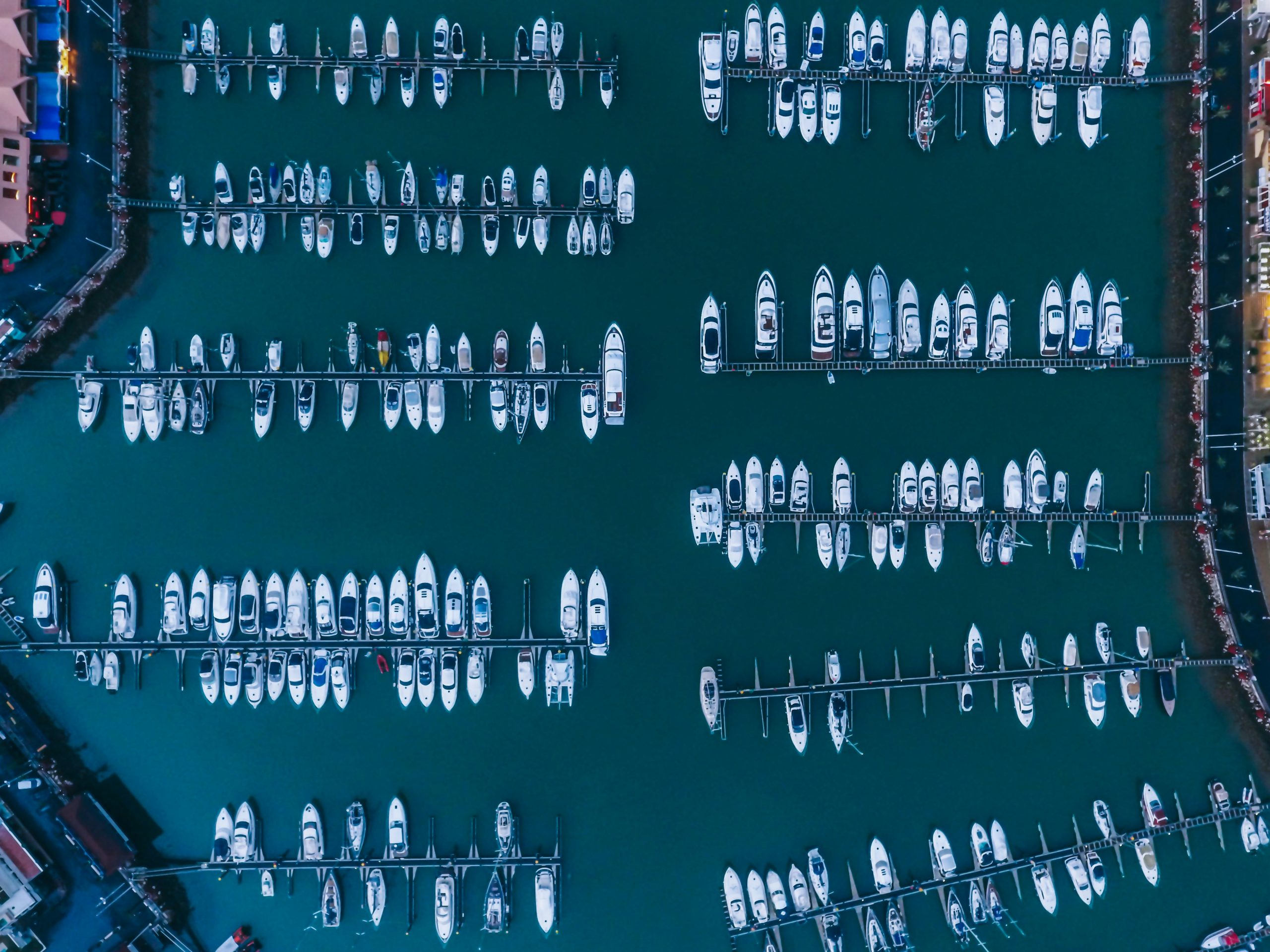 Aerial view of a Mediterranean harbour with boats and breakwaters