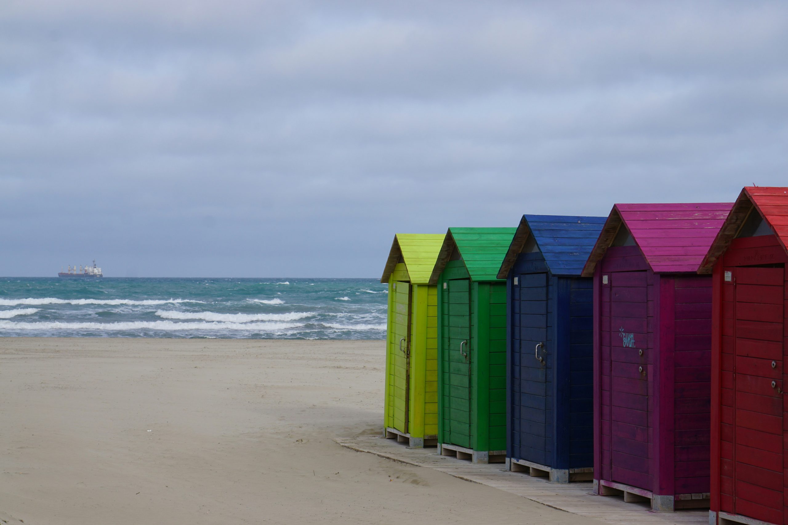 Colourful beach huts on a Mediterranean beach near Castellon
