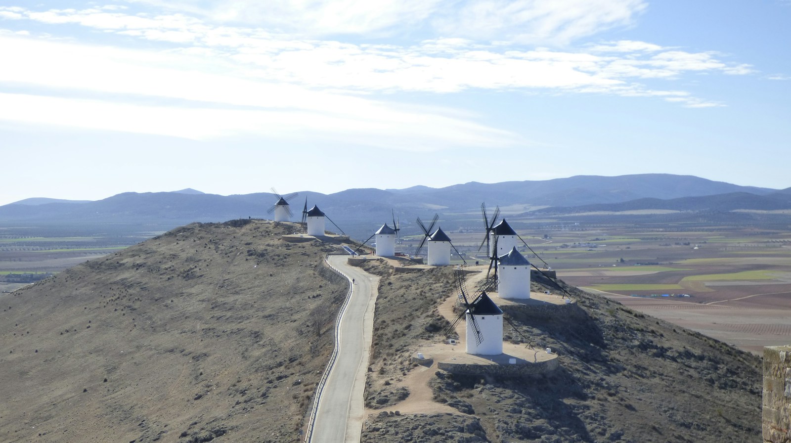 Windmills standing in the open landscape of Castilla-La Mancha