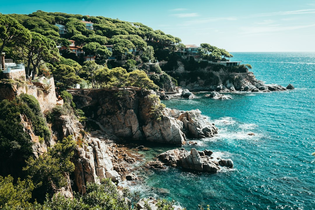 Bright blue Mediterranean sea and sunlit coastline near Lloret de Mar